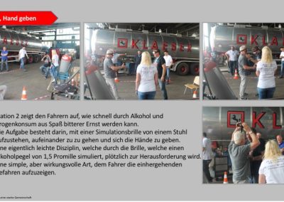 Teilnehmer sitzen sich bei einer Übung gegenüber mit einer VR-Brille an und sollen aufstehen und sich die Hand geben. Im Hintrgrund steht ein LKW der Firma Klaeser
